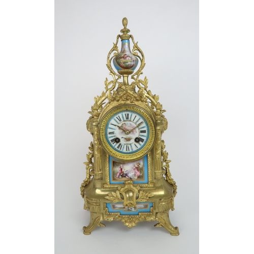 331 - A FRENCH GILT METAL CLOCK GARNITURE WITH S?VRES STYLE PORCELAIN PANELS