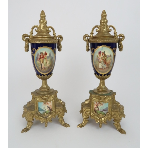 331 - A FRENCH GILT METAL CLOCK GARNITURE WITH S?VRES STYLE PORCELAIN PANELS