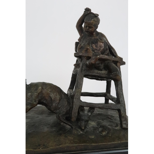 349 - A BRONZE OF A CHILD IN HIGH CHAIR