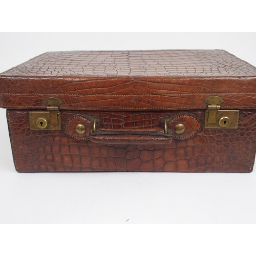 490 - A VICTORIAN CROCODILE SKIN DRESSING CASE