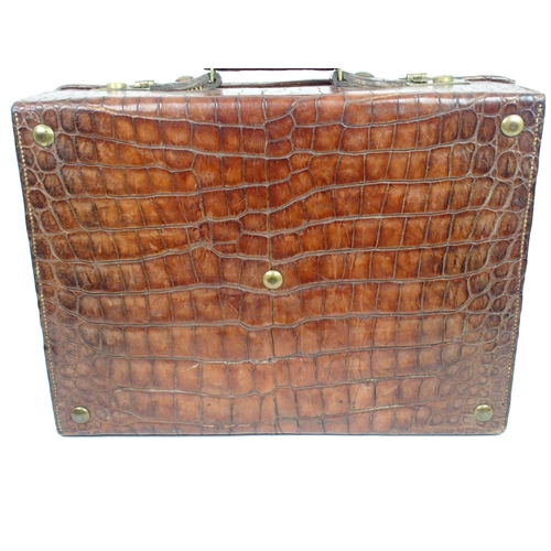 490 - A VICTORIAN CROCODILE SKIN DRESSING CASE