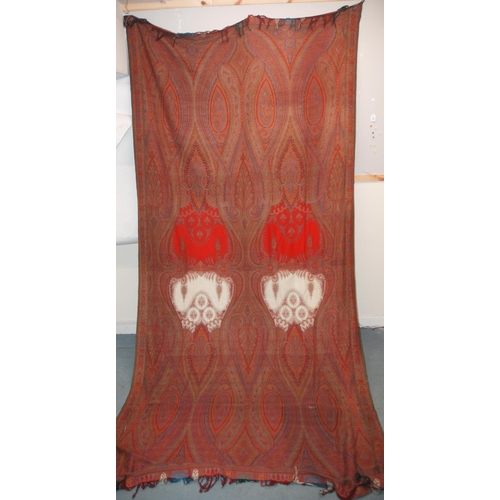 523 - A VICTORIAN RED GROUND PAISLEY SHAWL