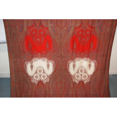 523 - A VICTORIAN RED GROUND PAISLEY SHAWL