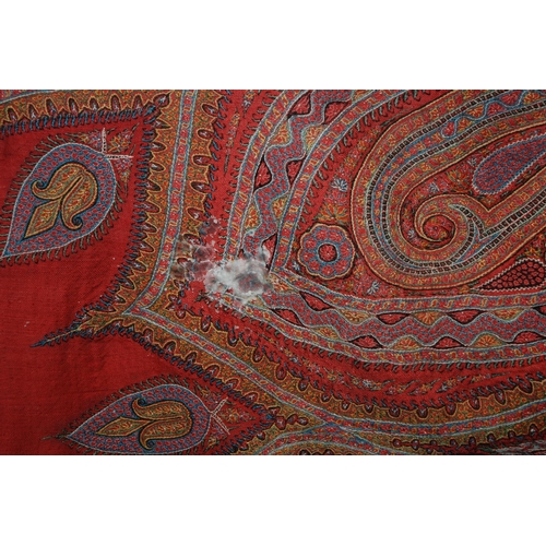 523 - A VICTORIAN RED GROUND PAISLEY SHAWL