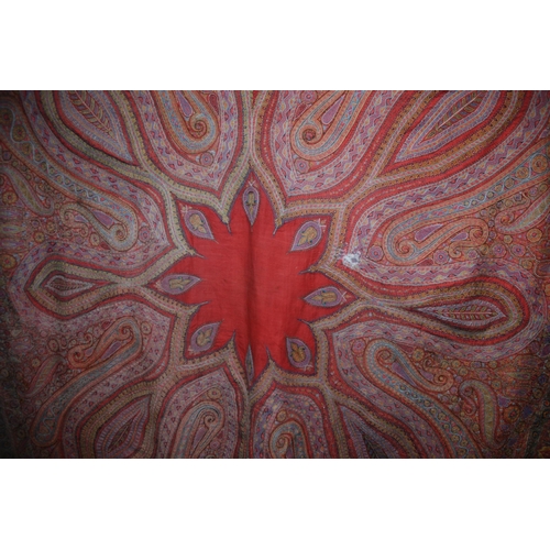 523 - A VICTORIAN RED GROUND PAISLEY SHAWL