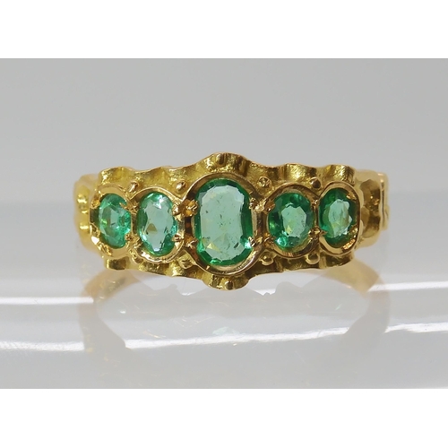 705 - AN 18CT GOLD VICTORIAN STYLE EMERALD RING