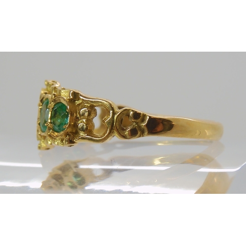 705 - AN 18CT GOLD VICTORIAN STYLE EMERALD RING