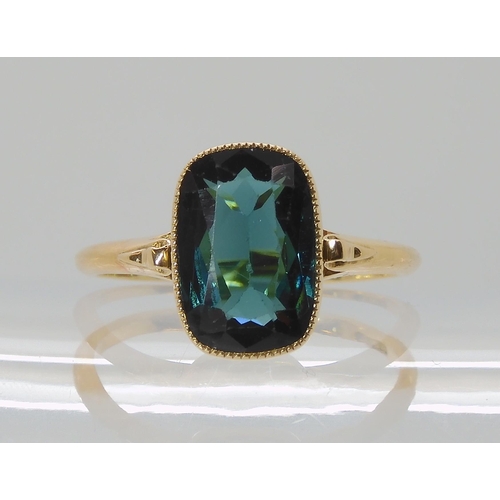 706 - A TEAL COLOURED TOURMALINE RING