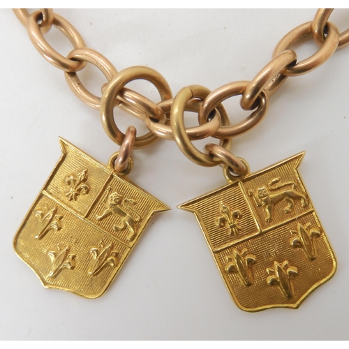 709 - AN 18CT GOLD FOB CHAIN WITH TWO ETON SCHOOL MEDALLIONS