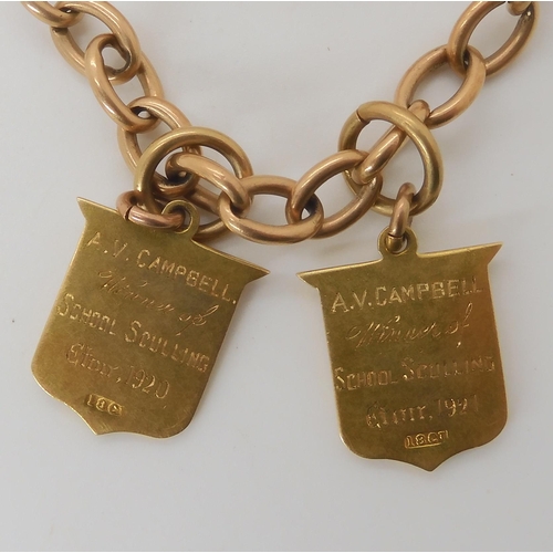 709 - AN 18CT GOLD FOB CHAIN WITH TWO ETON SCHOOL MEDALLIONS