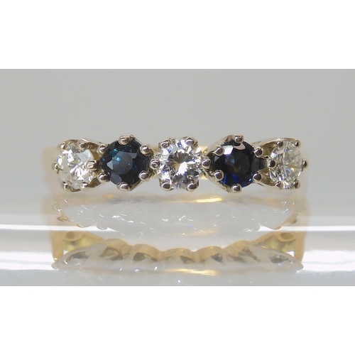 713 - A SAPPHIRE AND DIAMOND FIVE STONE RING