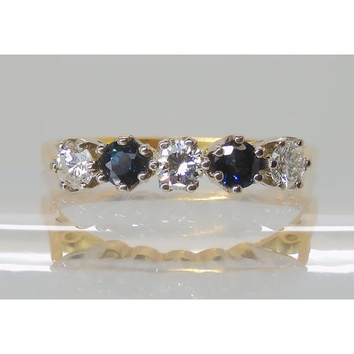 713 - A SAPPHIRE AND DIAMOND FIVE STONE RING