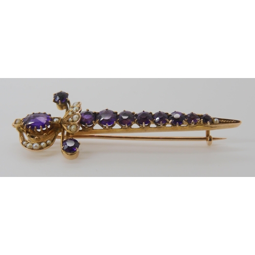 807 - A 9CT GOLD AMETHYST AND PEARL SWORD BROOCH