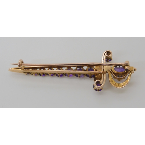 807 - A 9CT GOLD AMETHYST AND PEARL SWORD BROOCH