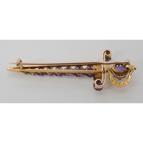 807 - A 9CT GOLD AMETHYST AND PEARL SWORD BROOCH