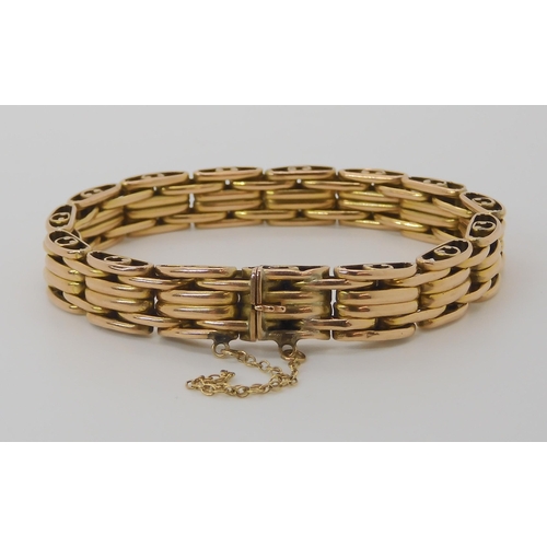 809 - A 15CT GOLD FANCY GATE BRACELET