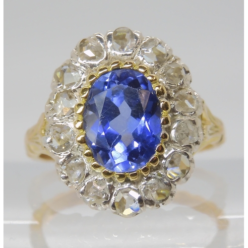 814 - AN 18CT GOLD ROSE CUT DIAMOND AND BLUE GEM SET RING