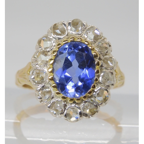 814 - AN 18CT GOLD ROSE CUT DIAMOND AND BLUE GEM SET RING