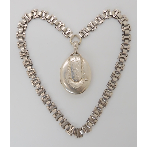 816 - A VICTORIAN SILVER LOCKET AND CHAIN