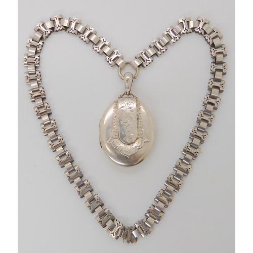 816 - A VICTORIAN SILVER LOCKET AND CHAIN