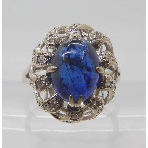 819 - A 14K WHITE GOLD BLUE GEMSTONE AND DIAMOND RING