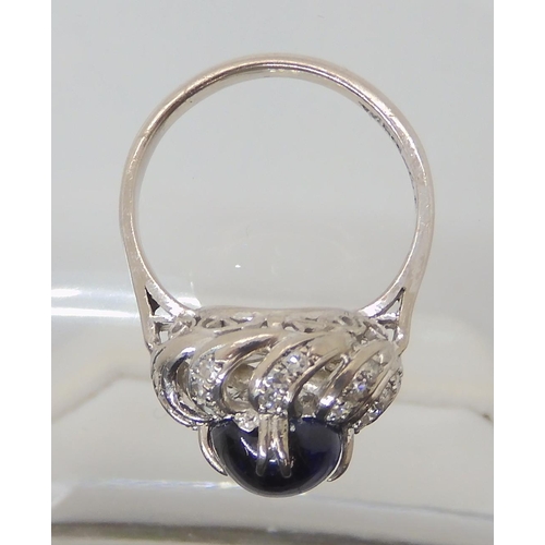 819 - A 14K WHITE GOLD BLUE GEMSTONE AND DIAMOND RING