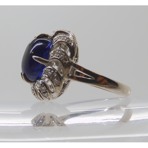 819 - A 14K WHITE GOLD BLUE GEMSTONE AND DIAMOND RING