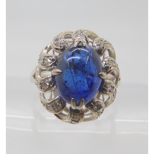 819 - A 14K WHITE GOLD BLUE GEMSTONE AND DIAMOND RING