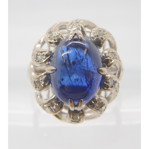 819 - A 14K WHITE GOLD BLUE GEMSTONE AND DIAMOND RING