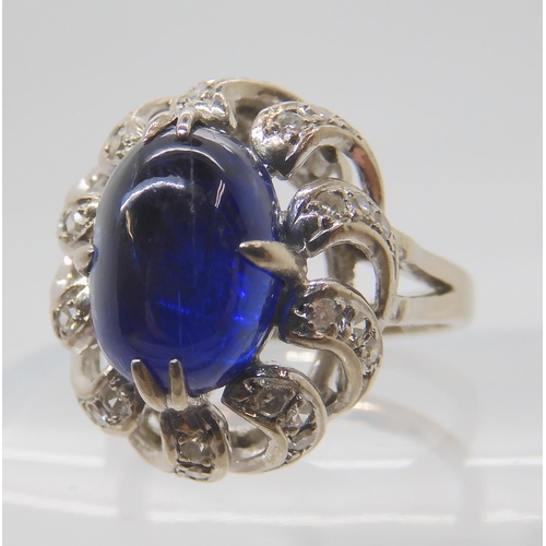 819 - A 14K WHITE GOLD BLUE GEMSTONE AND DIAMOND RING