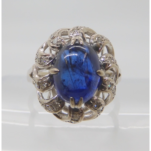 819 - A 14K WHITE GOLD BLUE GEMSTONE AND DIAMOND RING