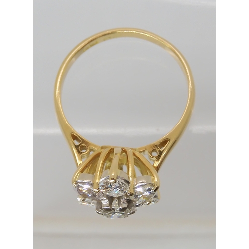 823 - AN 18CT GOLD DIAMOND FLOWER RING