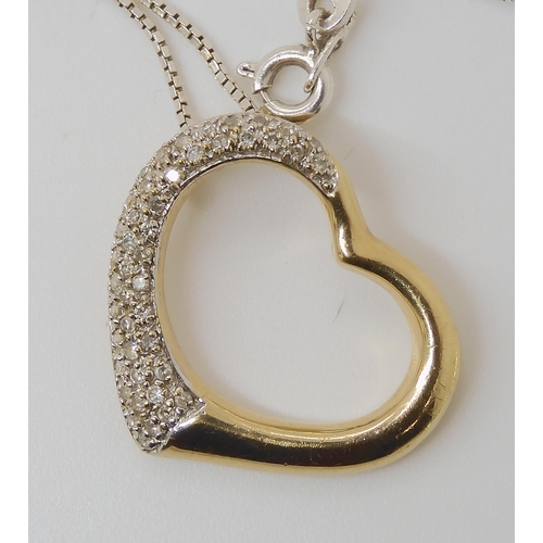 826 - A 9CT GOLD DIAMOND SET HEART PENDANT