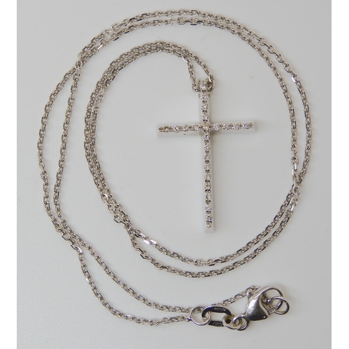 829 - AN 18CT WHITE GOLD DIAMOND SET CROSS AND CHAIN