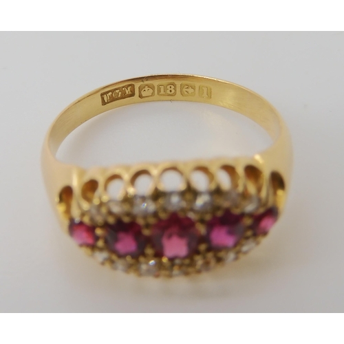 832 - AN 18CT GOLD RUBY AND DIAMOND RING