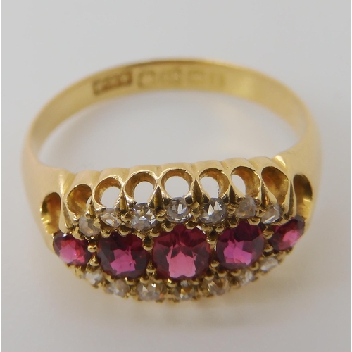 832 - AN 18CT GOLD RUBY AND DIAMOND RING