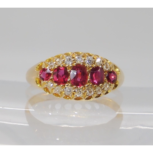 832 - AN 18CT GOLD RUBY AND DIAMOND RING