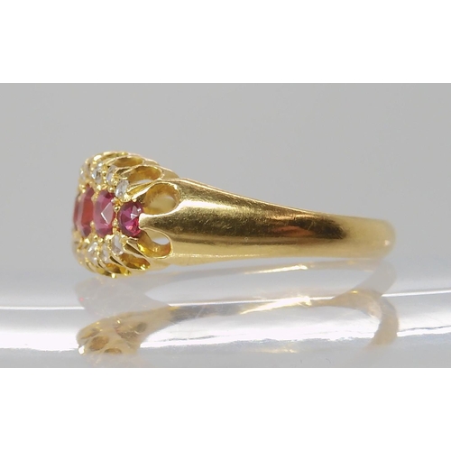 832 - AN 18CT GOLD RUBY AND DIAMOND RING