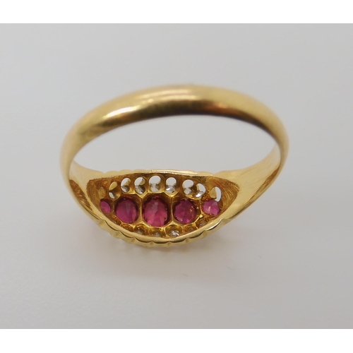 832 - AN 18CT GOLD RUBY AND DIAMOND RING