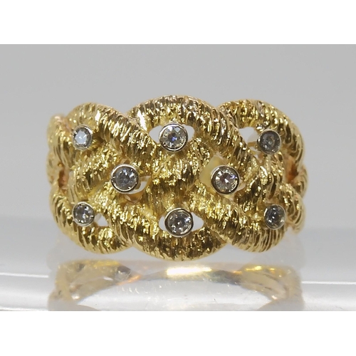 838 - AN 18CT GOLD DIAMOND SET KNOTWORK RING