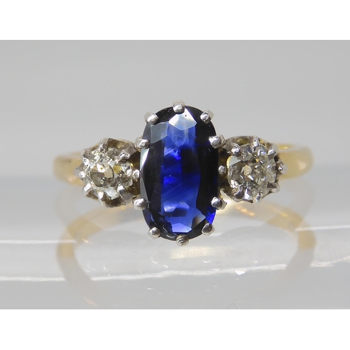 839 - A SAPPHIRE AND DIAMOND THREE STONE RING