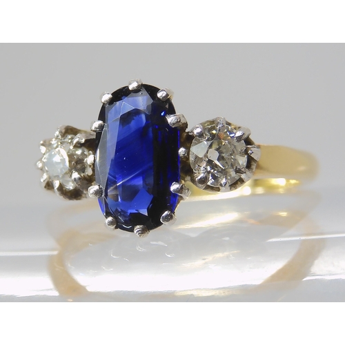 839 - A SAPPHIRE AND DIAMOND THREE STONE RING