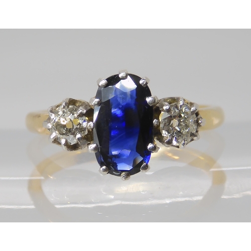 839 - A SAPPHIRE AND DIAMOND THREE STONE RING