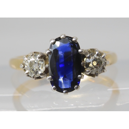 839 - A SAPPHIRE AND DIAMOND THREE STONE RING