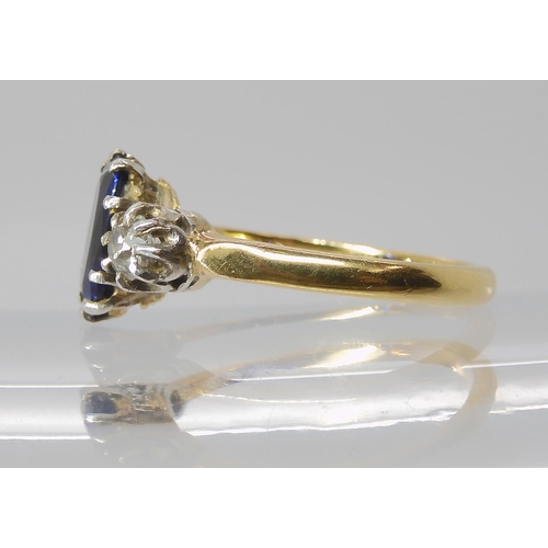 839 - A SAPPHIRE AND DIAMOND THREE STONE RING