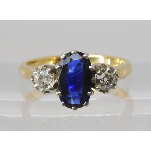 839 - A SAPPHIRE AND DIAMOND THREE STONE RING