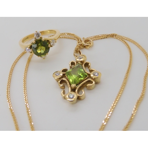 840 - AN 18CT BESPOKE PERIDOT AND DIAMOND PENDANT & RING