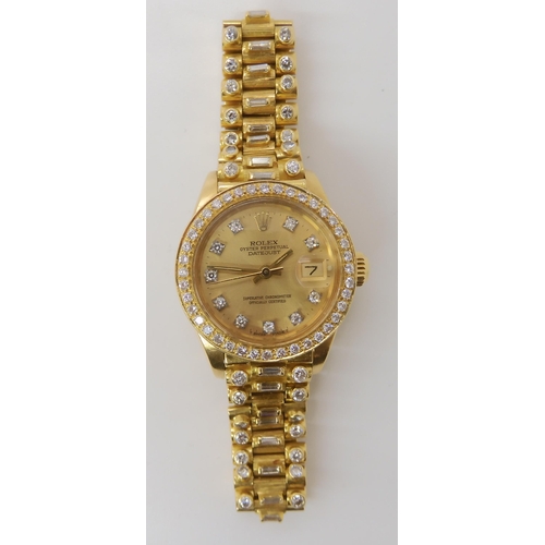 872 - AN 18CT GOLD LADIES ROLEX OYSTER PERPETUAL DATE JUST