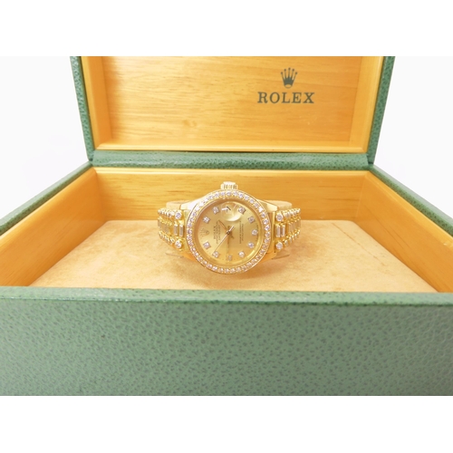 872 - AN 18CT GOLD LADIES ROLEX OYSTER PERPETUAL DATE JUST