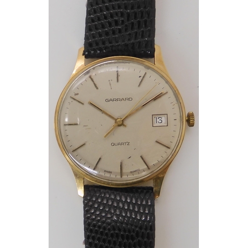 894 - A 9CT GOLD GARRARD QUARTZ WATCH